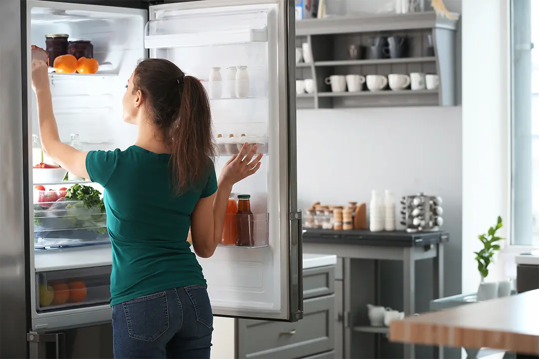 woman using fridge